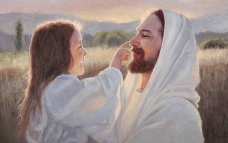 女の子がイエス様の鼻を指す